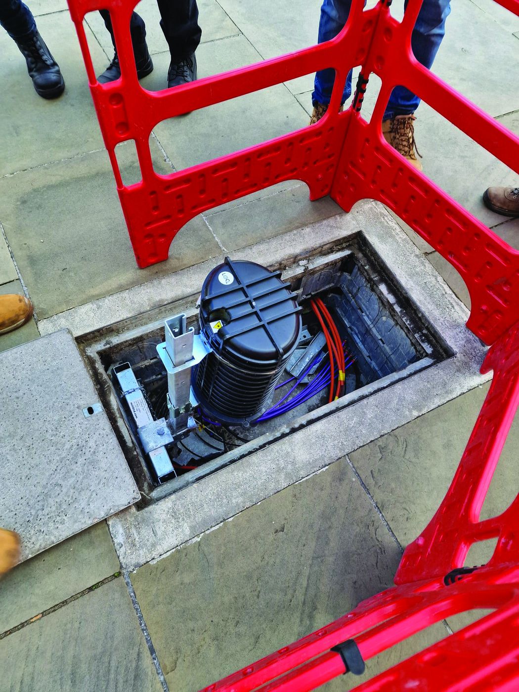 Deployed equipment inside a footway chamber, labeled with LOC tags